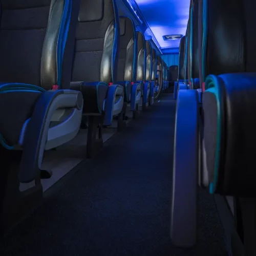 Modern Comfortable International Shuttle Coach Bus Modern Comfortable International Shuttle Coach Bus with Blue Ambient Light Illumination.
